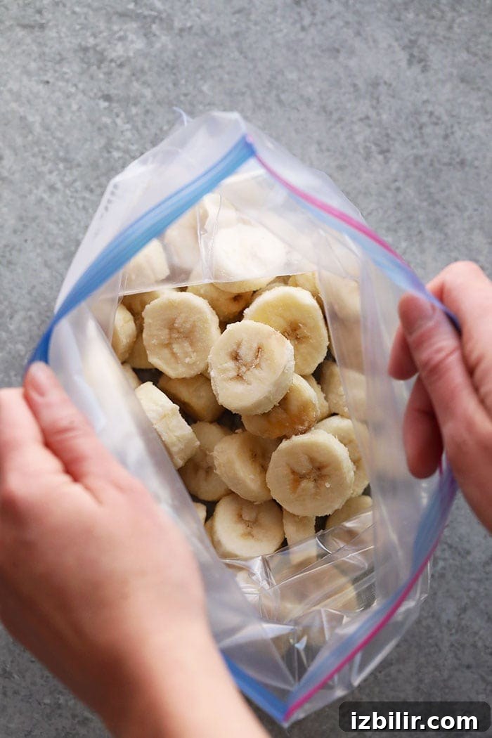 Frozen banana slices in a freezer bag Frozen sliced bananas in a freezer safe bag