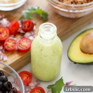 A jar of avocado cilantro lime dressing in a small image