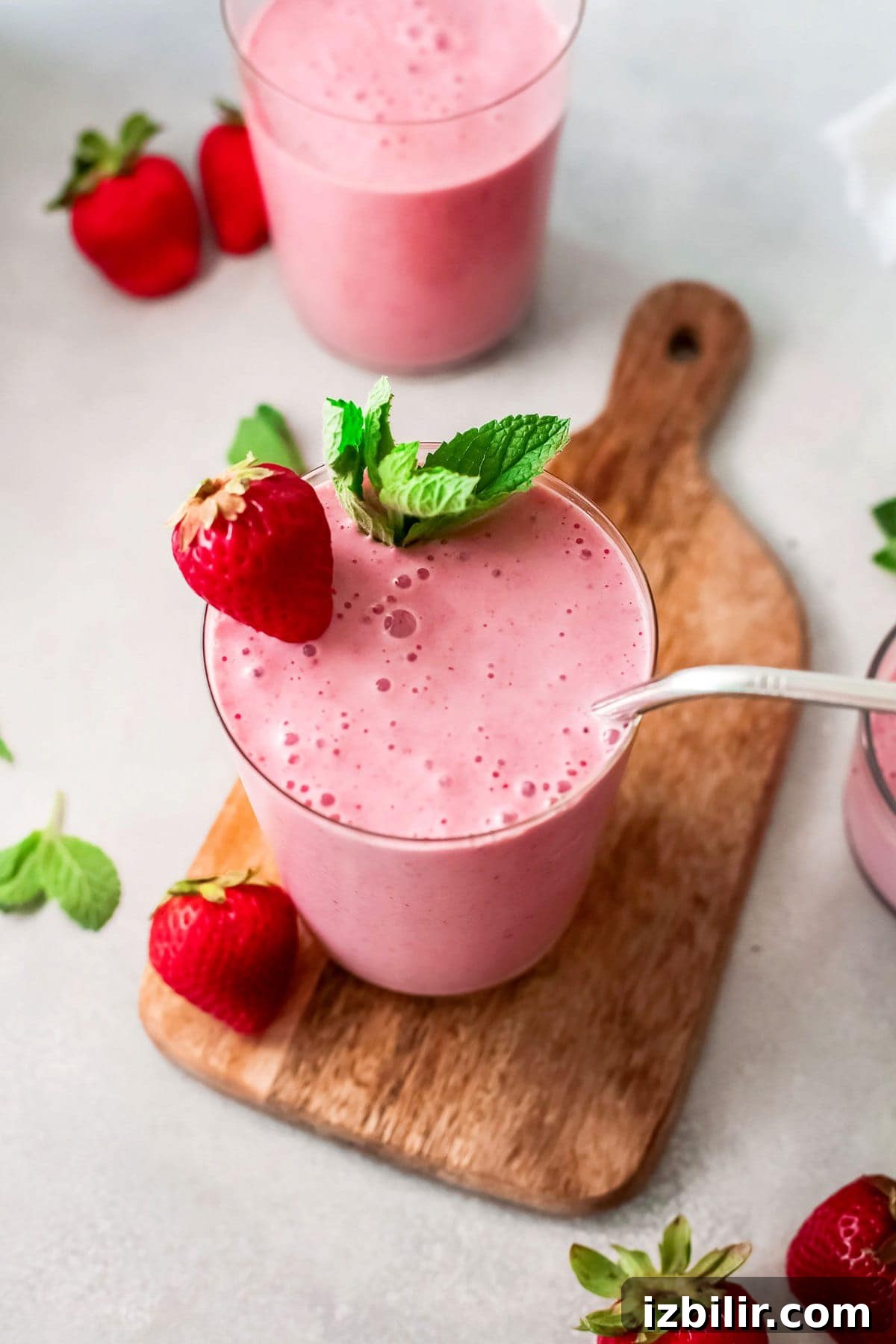 The most delicious fruit smoothie is a classic strawberry banana smoothie made with frozen fruit, Greek yogurt, and milk. Enjoy! strawberry banana smoothie on cutting board