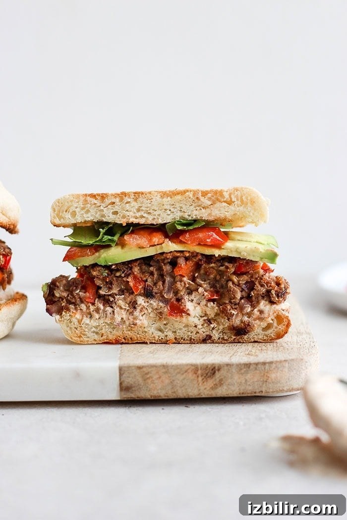 Black bean quinoa burger with roasted garlic black bean burger in an english muffin
