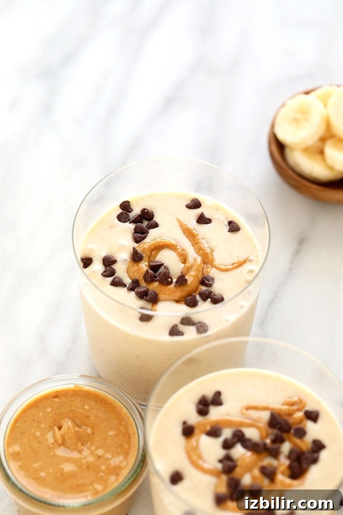 Peanut butter and banana is a fan favorite when it comes to flavor combos. That's why this peanut butter banana smoothie is a show-stopping smoothie recipe you need to make! We kept this peanut butter and banana smoothie recipe simple with just 6 total ingredients! Keep reading to get the recipe and dig in! Peanut Butter Banana Smoothie in glass.