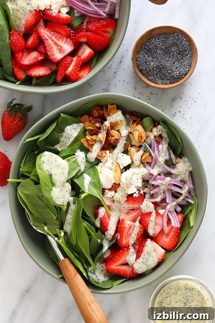 Strawberry Spinach Salad with chia seeds and candied almonds