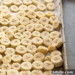sliced bananas on a baking sheet