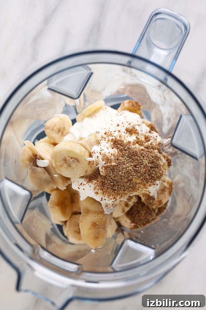 Ingredients for a banana smoothie in a blender