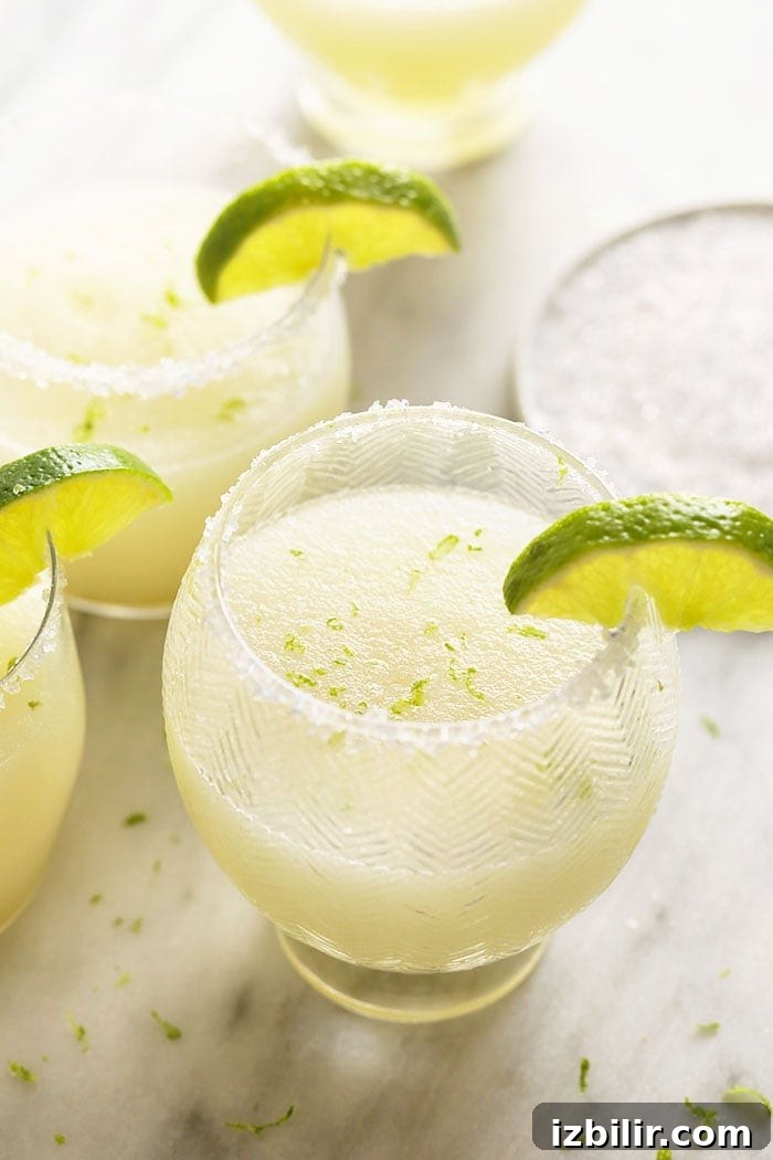 With just 5 basic ingredients you can whip up the best frozen margarita recipe in under 10 minutes! Frozen Margaritas in glasses with limes.