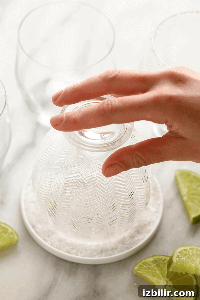 How to salt a glass for margaritas dipping glass in sea salt.