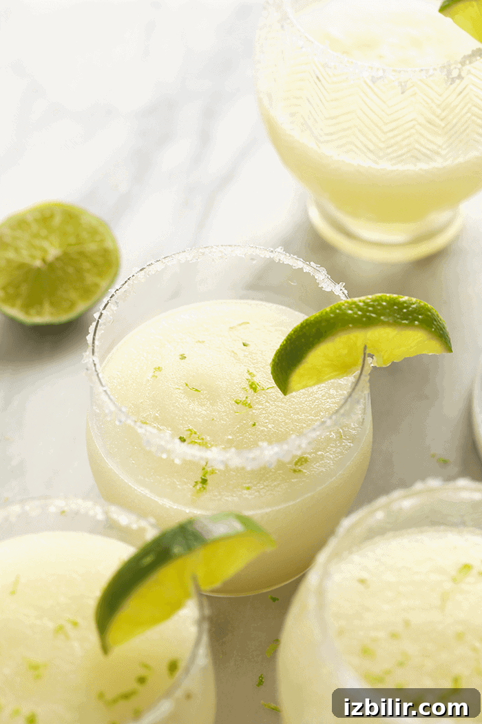 Lime juice, triple sec, tequila, agave nectar, and ice are all you need! Frozen Margarita with lime.