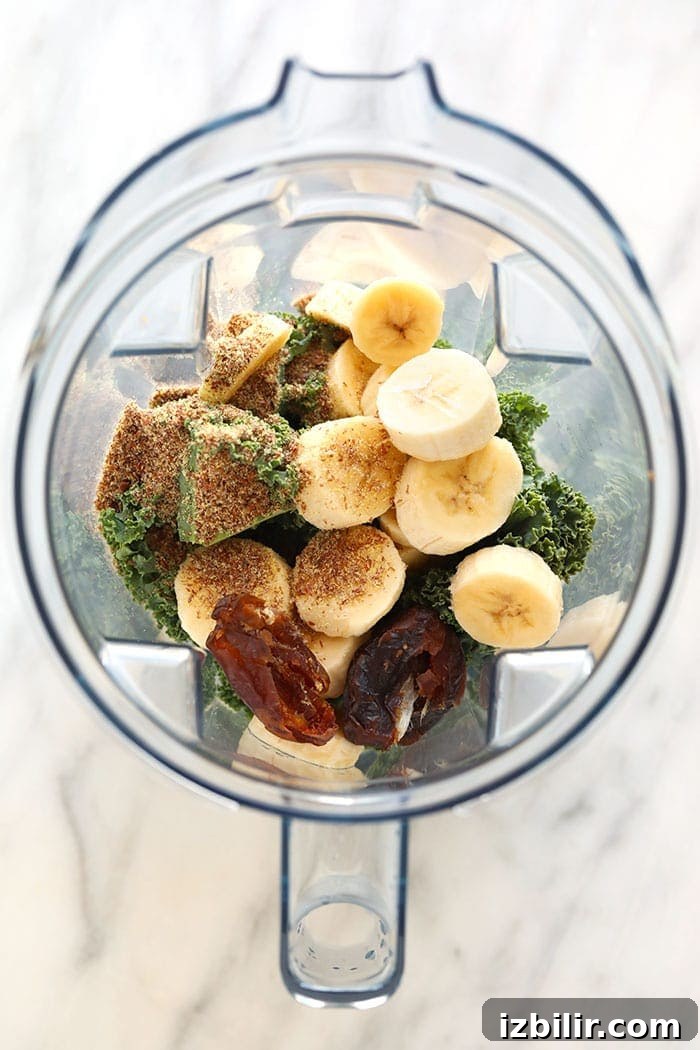 Kale smoothie ingredients in a blender kale smoothie ingredients in a blender.