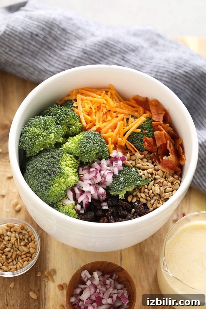 Ingredients for healthy broccoli salad with bacon in a bowl.