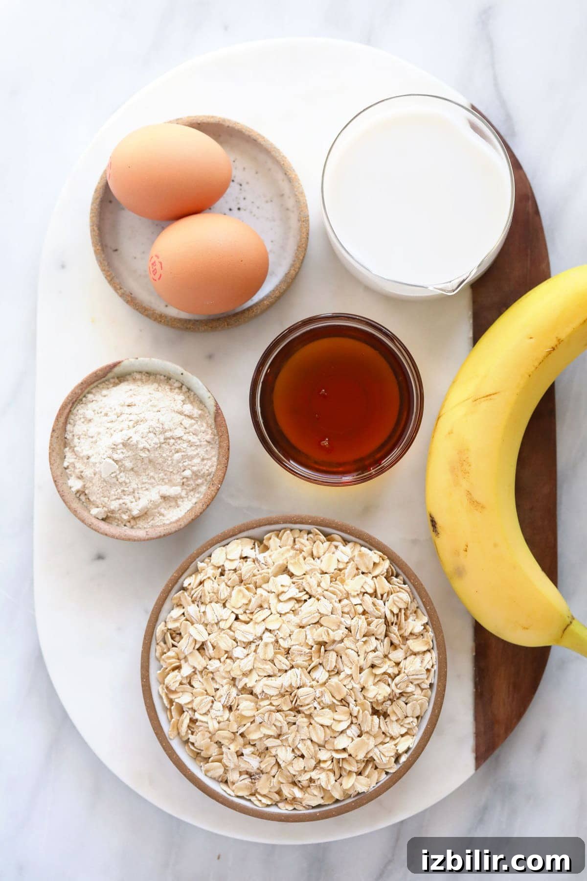 oatmeal, eggs, flour, banana, milk, and maple syrup