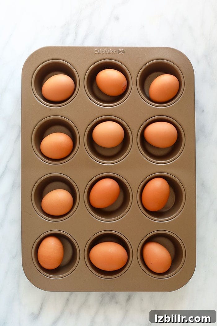 Raw eggs in a muffin tin