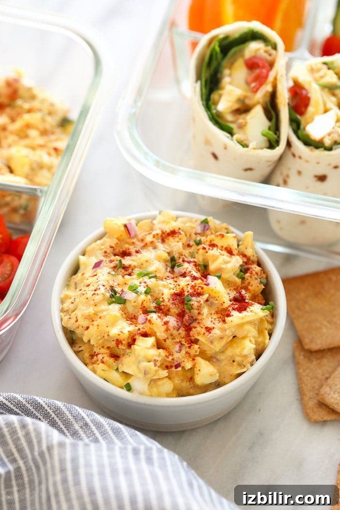 Tuna Salad with egg takes classic tuna salad up a natch by adding in hard-boiled eggs. This tuna salad recipe with egg whips up in no time and it's healthy! tuna egg salad recipe in a bowl