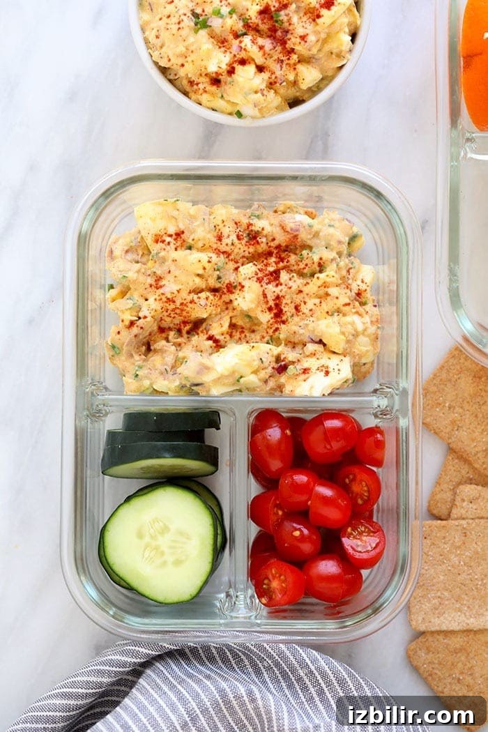 This Tuna Egg Salad blends the flavors you love from tuna salad with egg salad for a satisfying and protein-packed lunch! tuna egg salad in a meal prep container