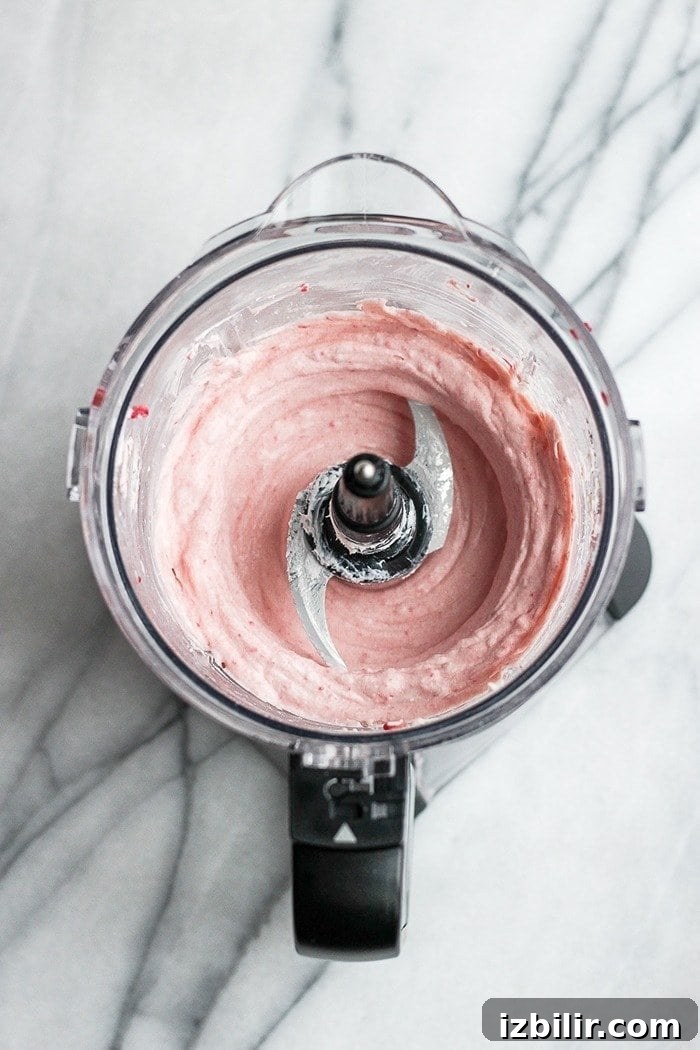 Keto Raspberry Cheesecake Fat Bombs 5 Fat bomb batter in a food processor