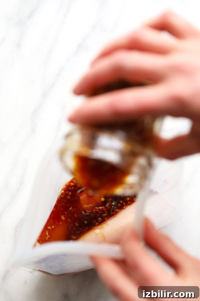 pouring sauce into bag