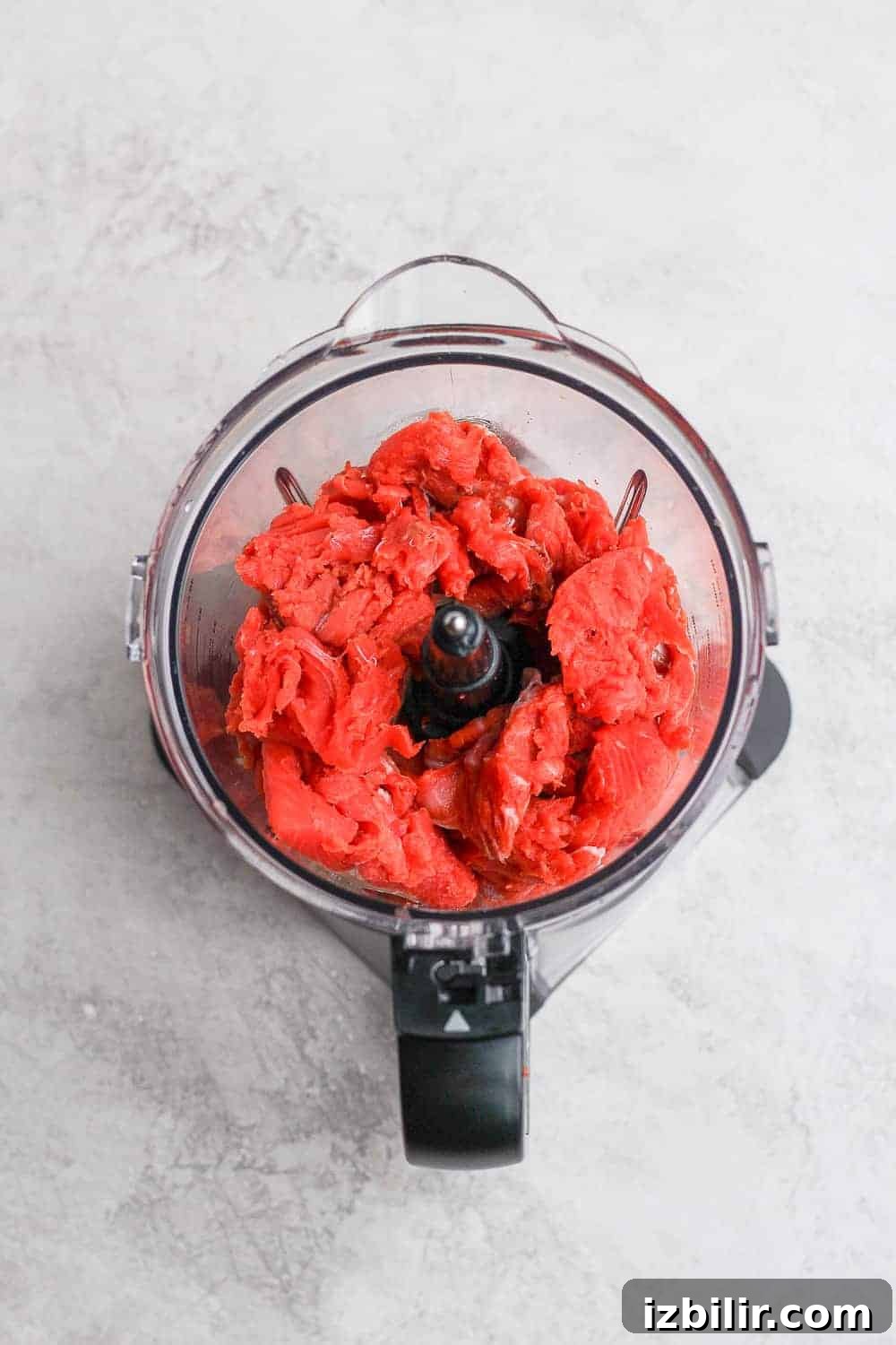 Fresh salmon ground for patties salmon chunks in food processor