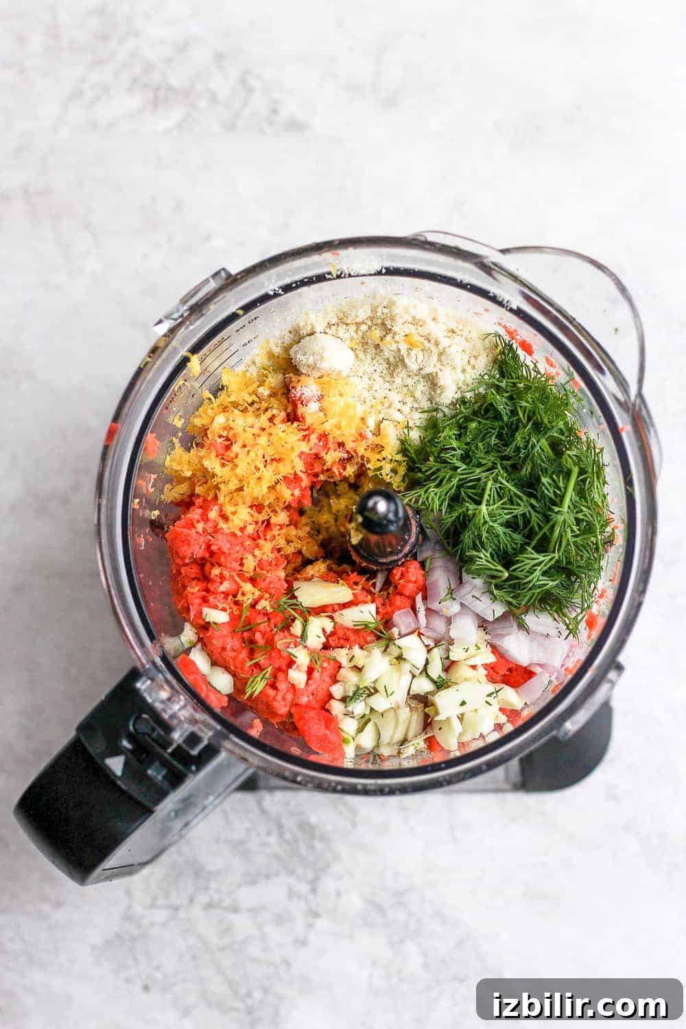 Ingredients prepared for salmon burgers salmon burger ingredients in food processor