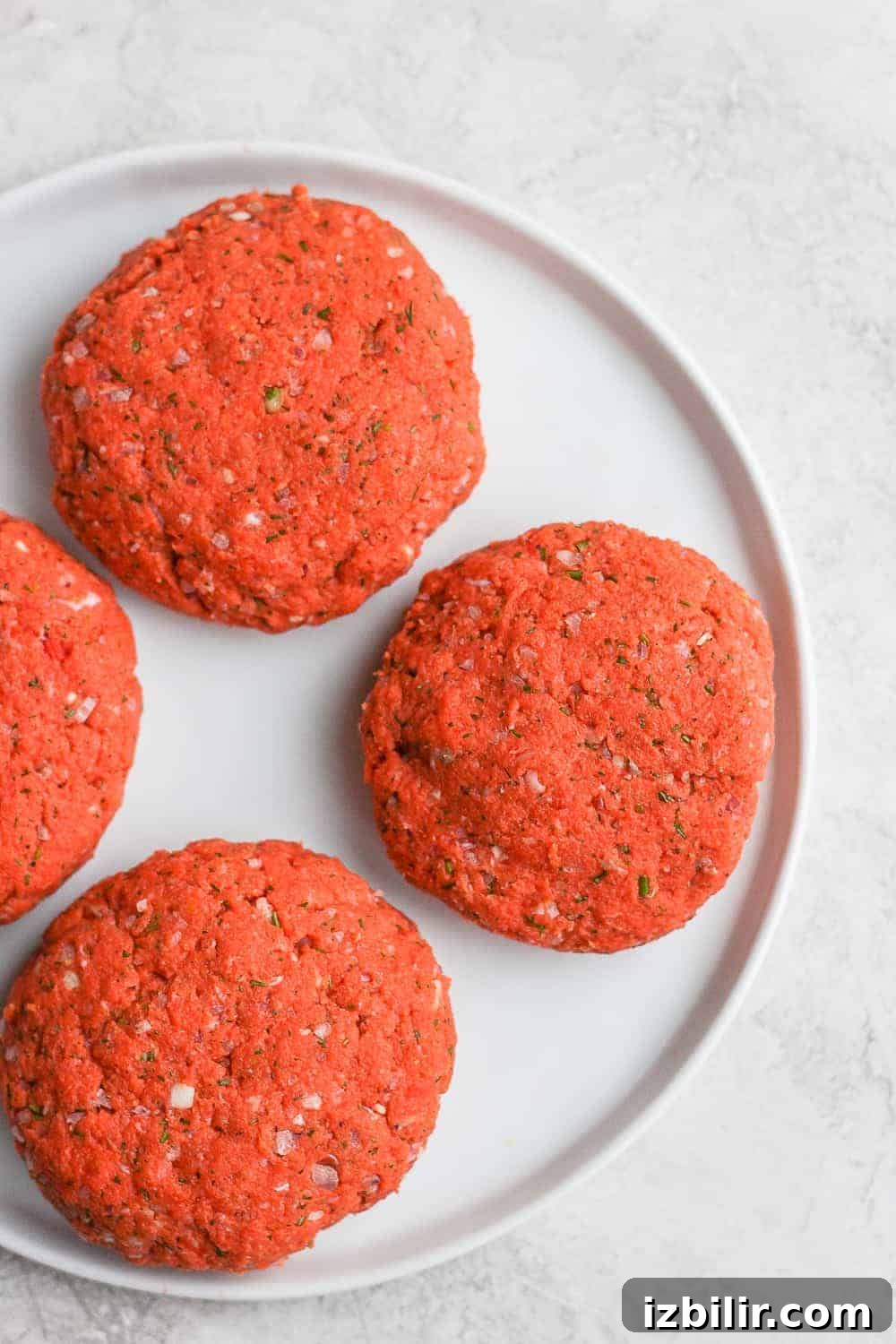 Raw salmon patties ready to cook raw salmon patties on plate