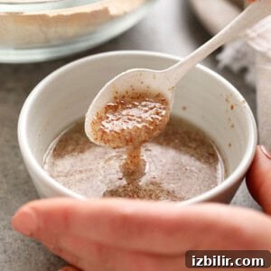 How to Make a Flax Egg for Vegan Baking 2 Mixing a flax egg in a bowl.