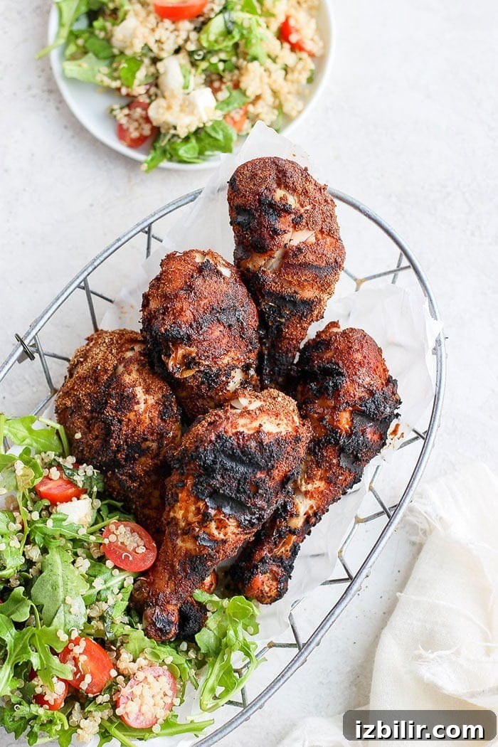 Grilled chicken legs served with salad chicken legs in basket with salad.