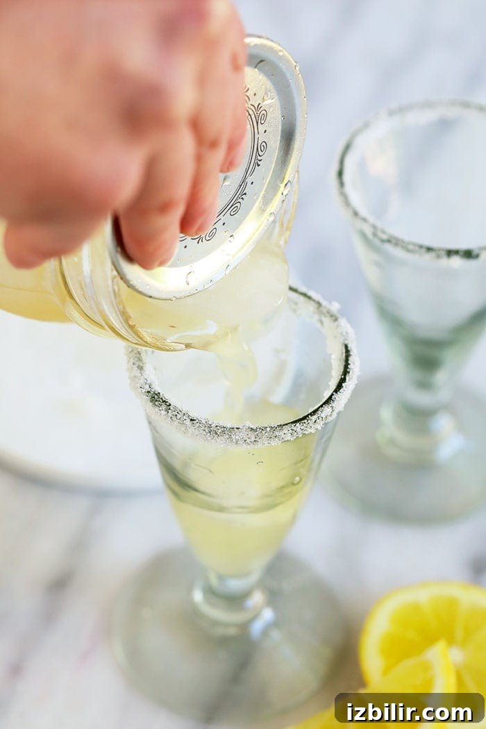 Pouring lemon drop martini Pouring lemon drop into a glass