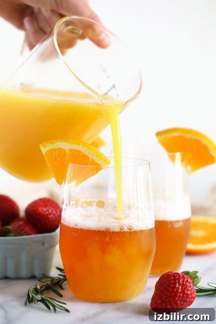 Pouring orange juice into a glass