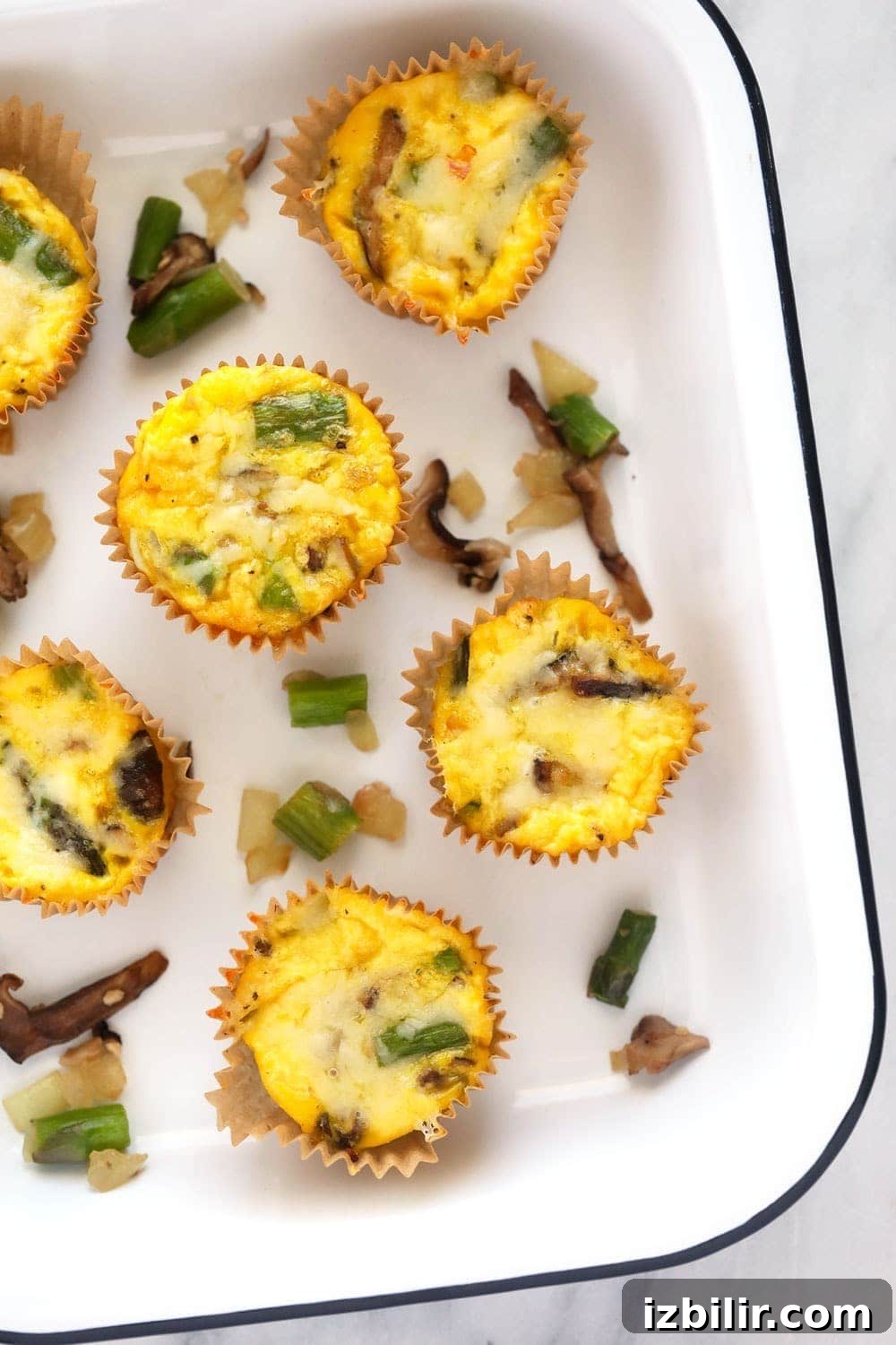 Asparagus and mushroom egg cups asparagus and mushroom egg cups in a pan