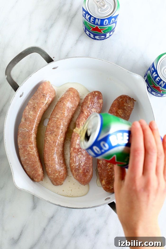 Uncooked brats in pan uncooked brats in pan