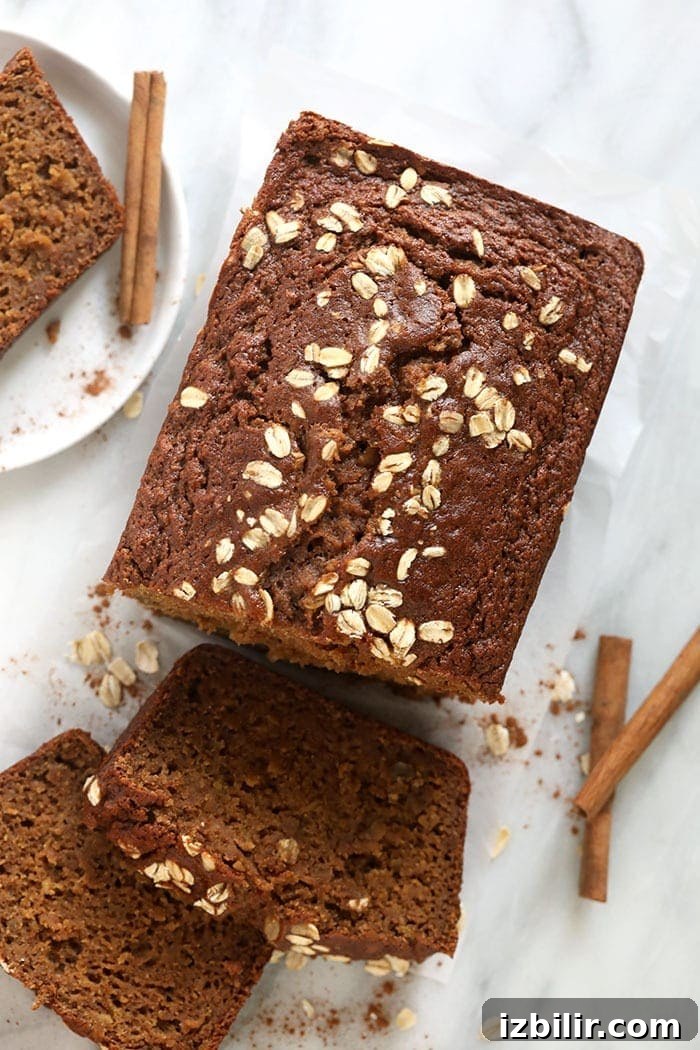 Homemade Apple Cinnamon Bread Recipe 2 Cinnamon apple bread loaf sliced on a plate.