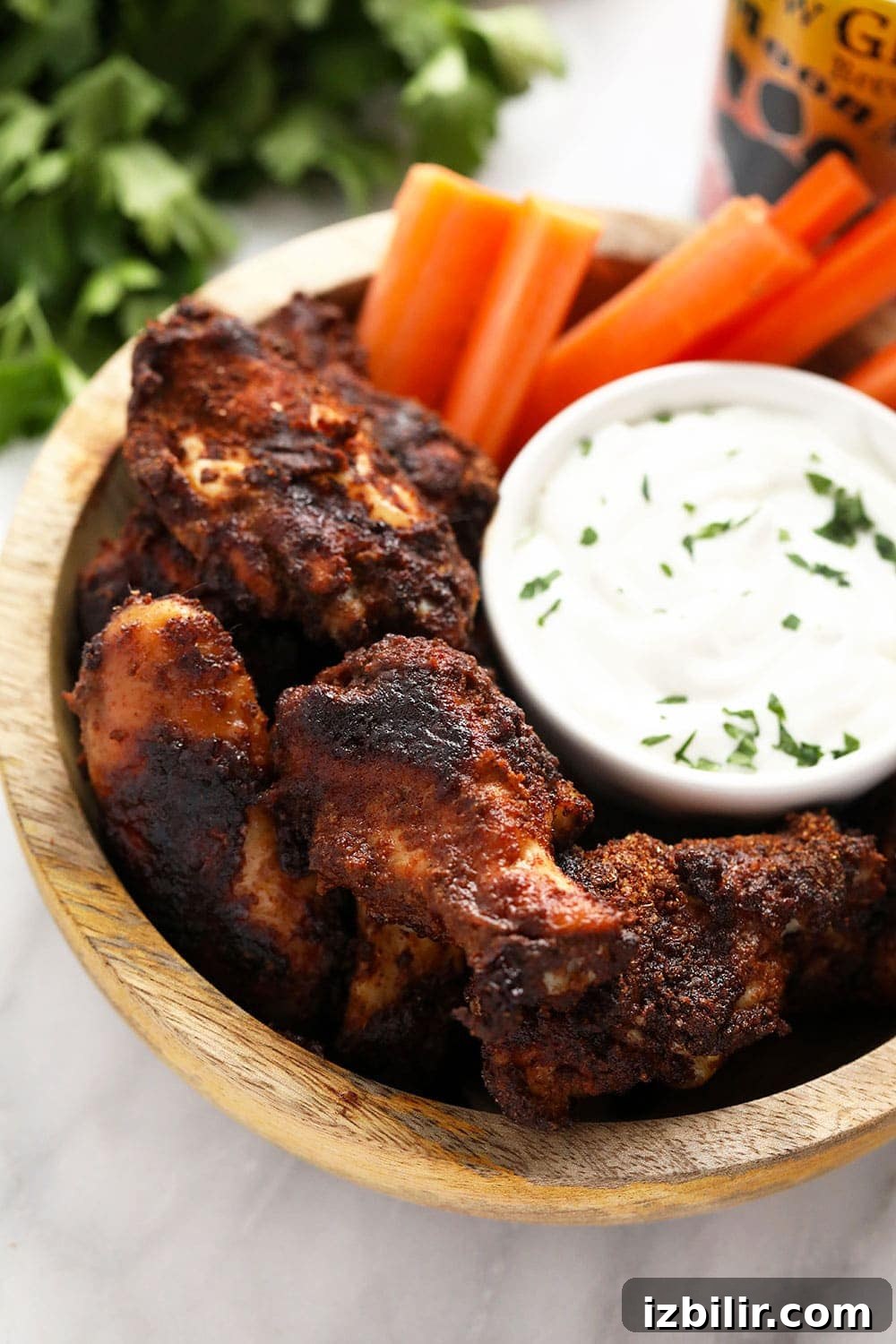 Crispy dry rub chicken wings with blue cheese dip Dry rub chicken wings with blue cheese dip in a bowl