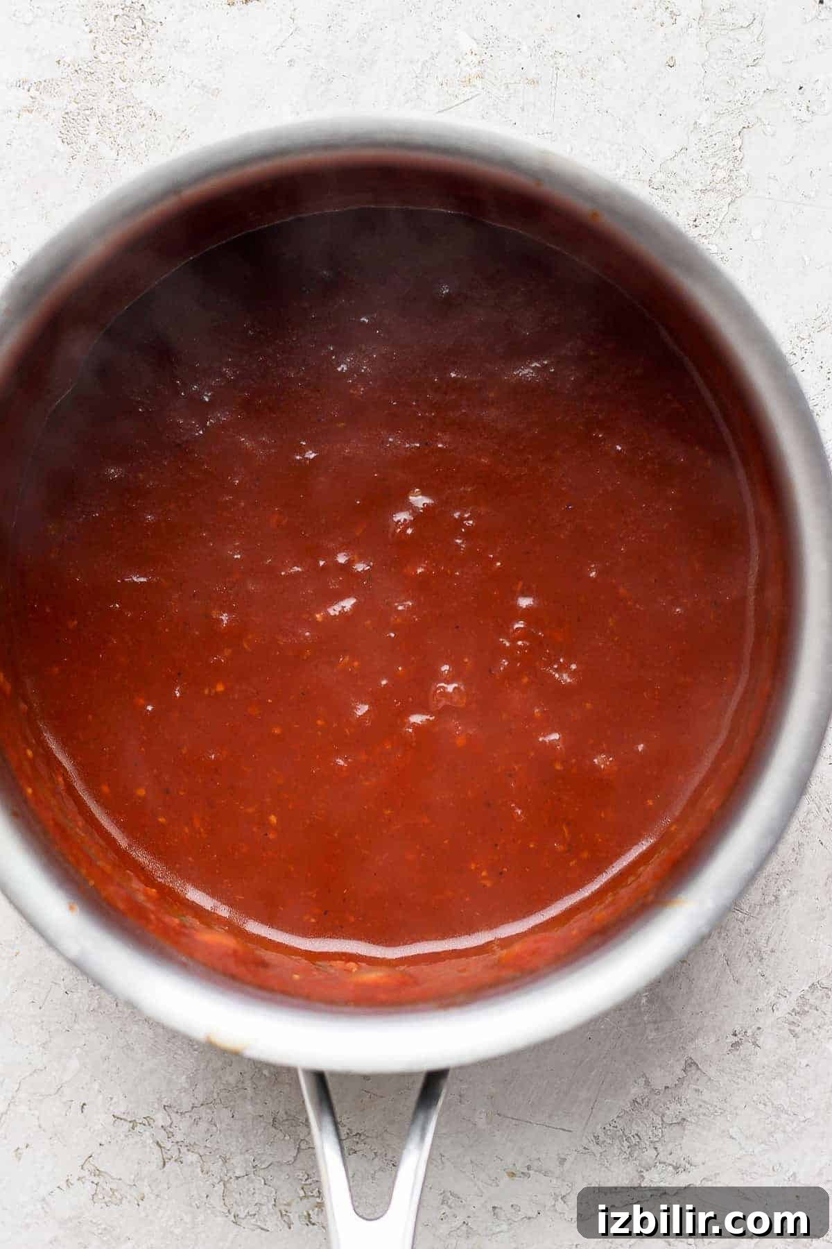 homemade BBQ sauce ingredients simmering in a sauce pan.