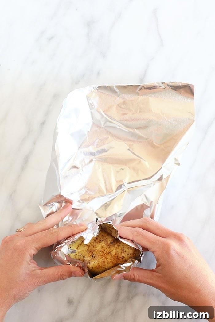 Crispy Foil-Wrapped Baked Potatoes 4 rolling potatoes in foil