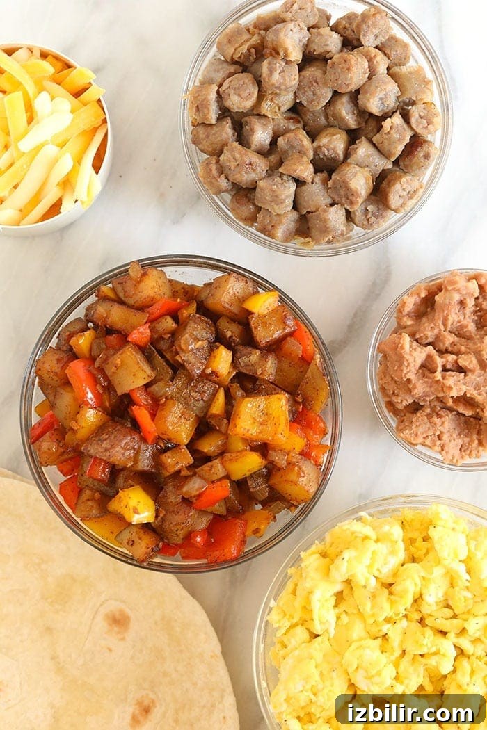 Ingredients for fajita breakfast burritos Fajita breakfast burrito ingredients in bowls