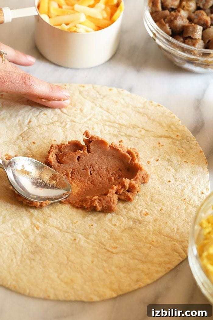 Rolling fajita breakfast burritos Preparing fajita breakfast burritos