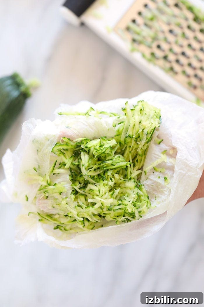 Draining shredded zucchini to remove moisture how to remove the moisture from shredded zucchini