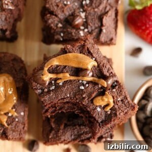 Paleo chocolate peanut butter brownies on a cutting board.