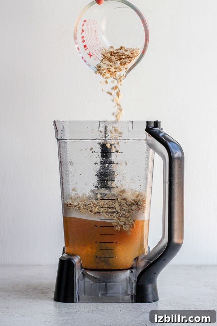 Pouring oats into a blender