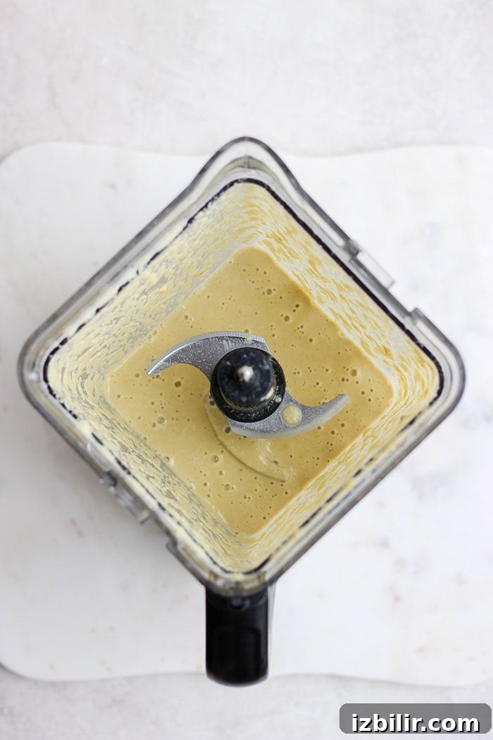 Blending the cashew cream sauce creamy cashew curry sauce in a blender