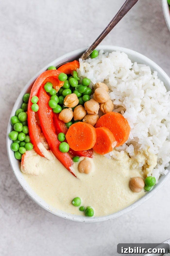 Cashew curry served with rice creamy cashews curry and veggies in a bowl with rice