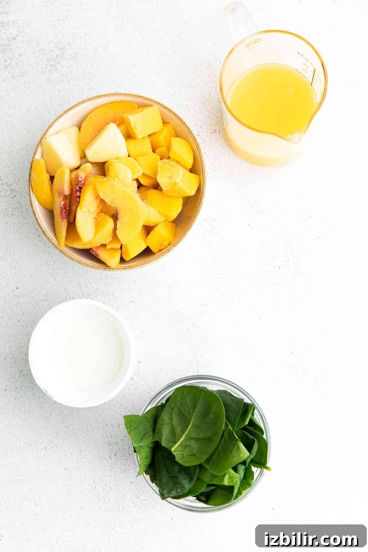 Tropical Spinach Smoothie with Pineapple and Mango 3 All the ingredients for the spinach smoothie in small bowls.