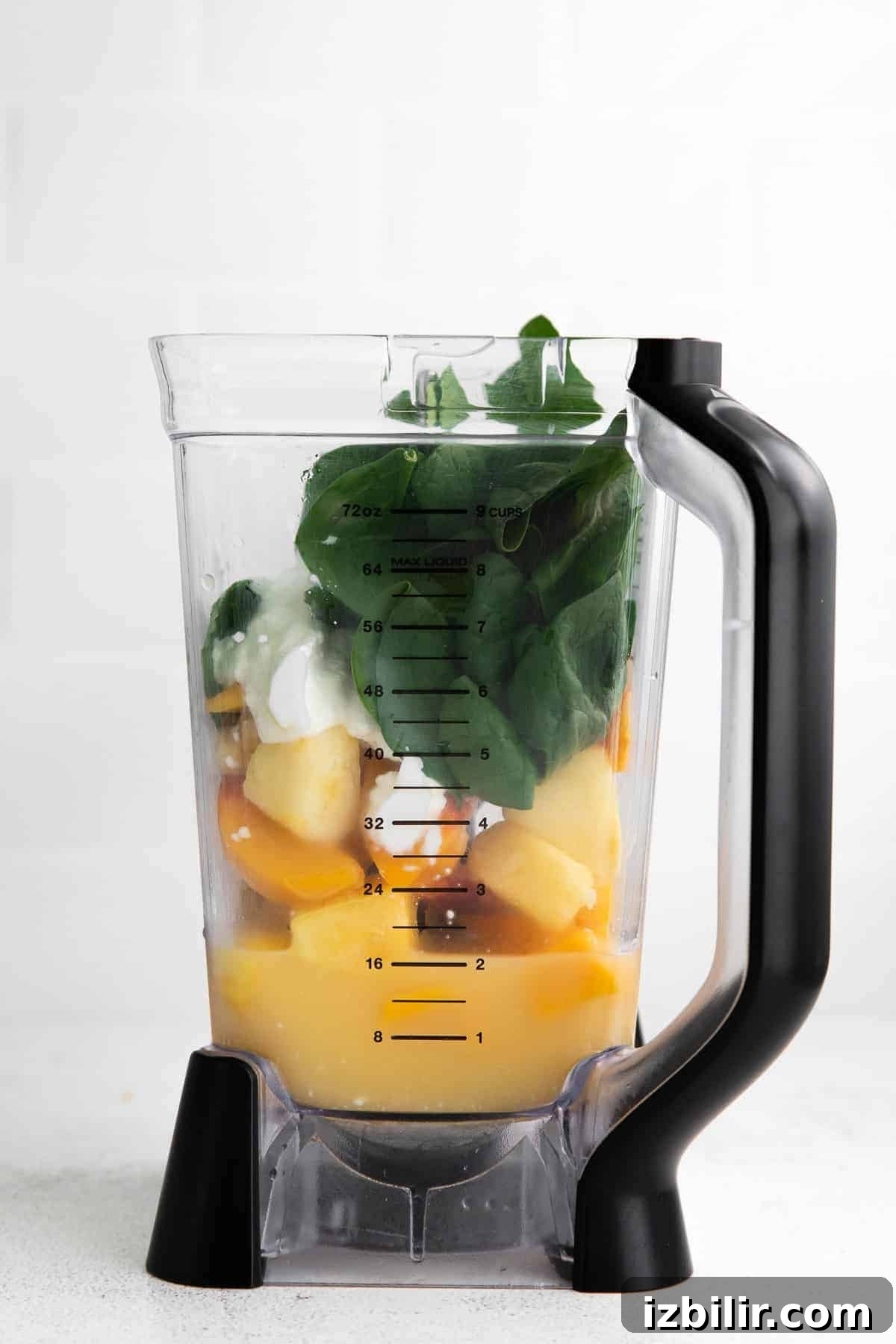 Tropical Spinach Smoothie with Pineapple and Mango 4 All the ingredients for the spinach smoothie in a blender.