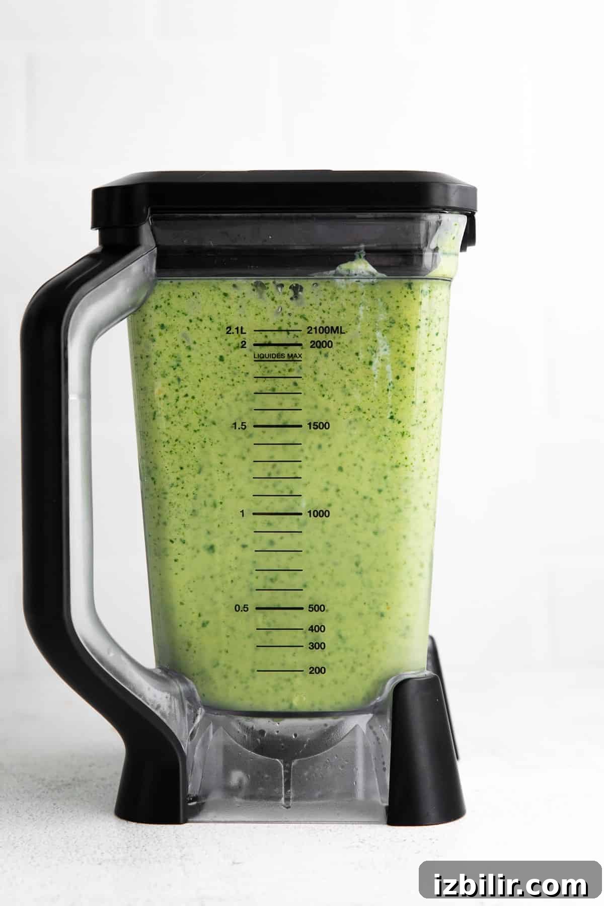 Tropical Spinach Smoothie with Pineapple and Mango 5 Tropical Spinach Smoothie blended up in a blender.