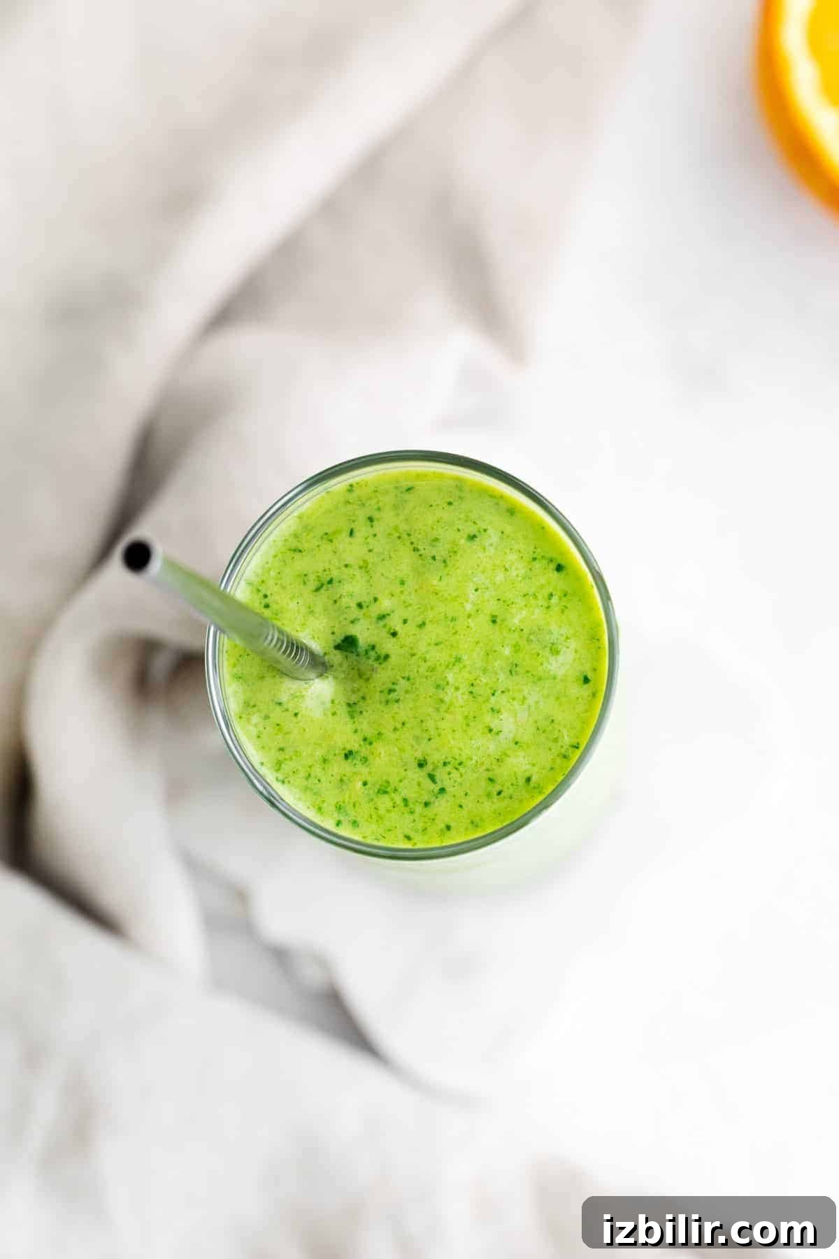 Tropical Spinach Smoothie with Pineapple and Mango 6 A spinach smoothie from the top of a glass.