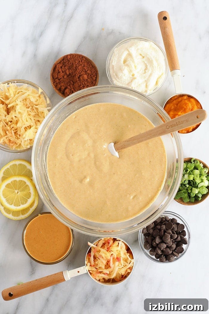 If you love pancakes, add this healthy pancake recipe to the list! This is our favorite pancake base recipe + 6 healthy pancake recipes you can make with it. Start flipping those flapjacks! Pancake batter in a bowl with ingredients surrounding it.