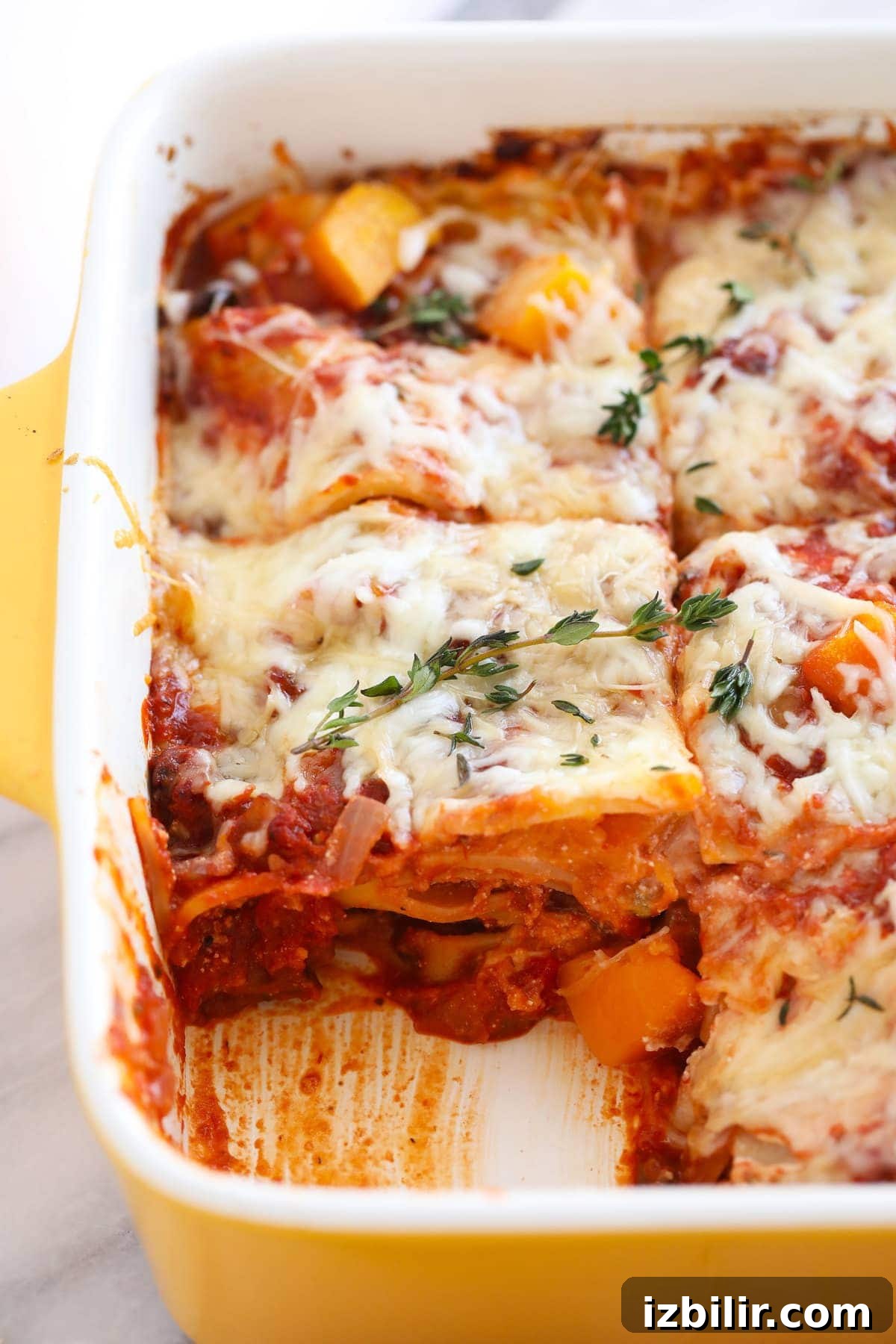 Layers of lasagna shown in a pan.