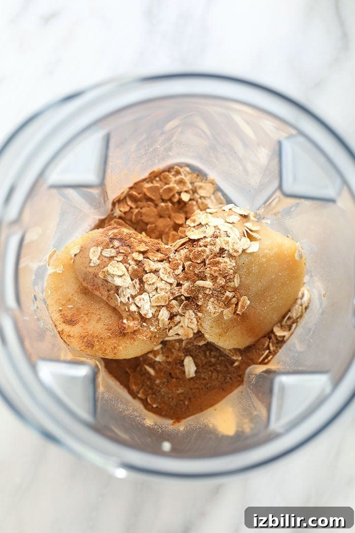 Creamy Apple Smoothie with Cinnamon and Greek Yogurt 2 apple smoothie ingredients in a blender