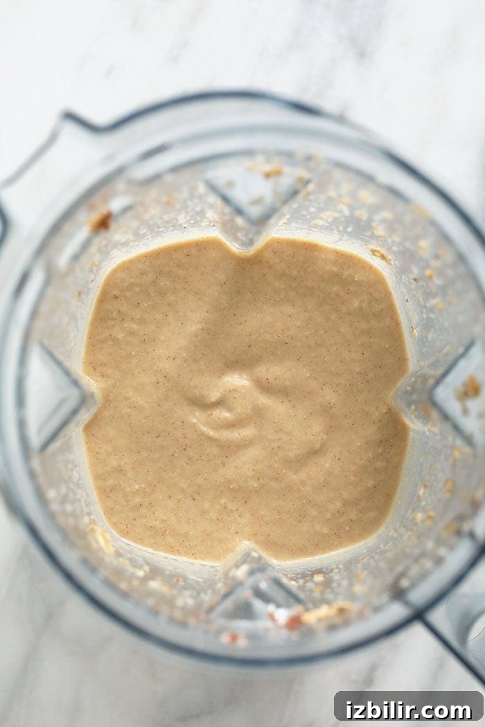 Creamy Apple Smoothie with Cinnamon and Greek Yogurt 3 apple smoothie blended in a blender