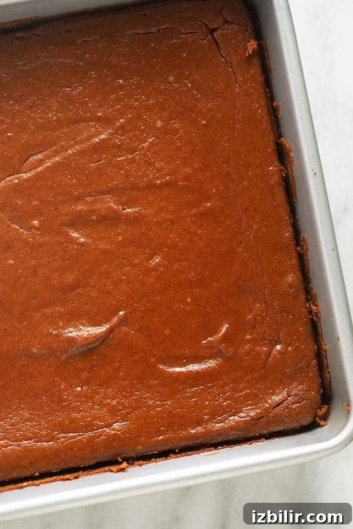 pumpkin cheesecake bars in a pan