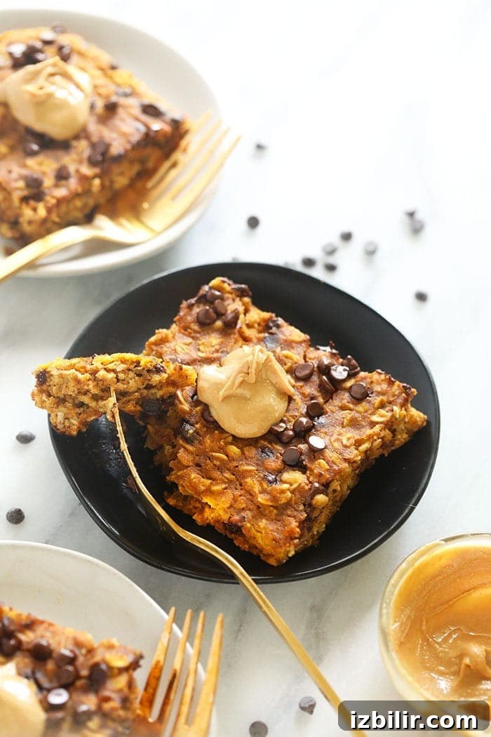 Slice of pumpkin baked oatmeal with cashew butter