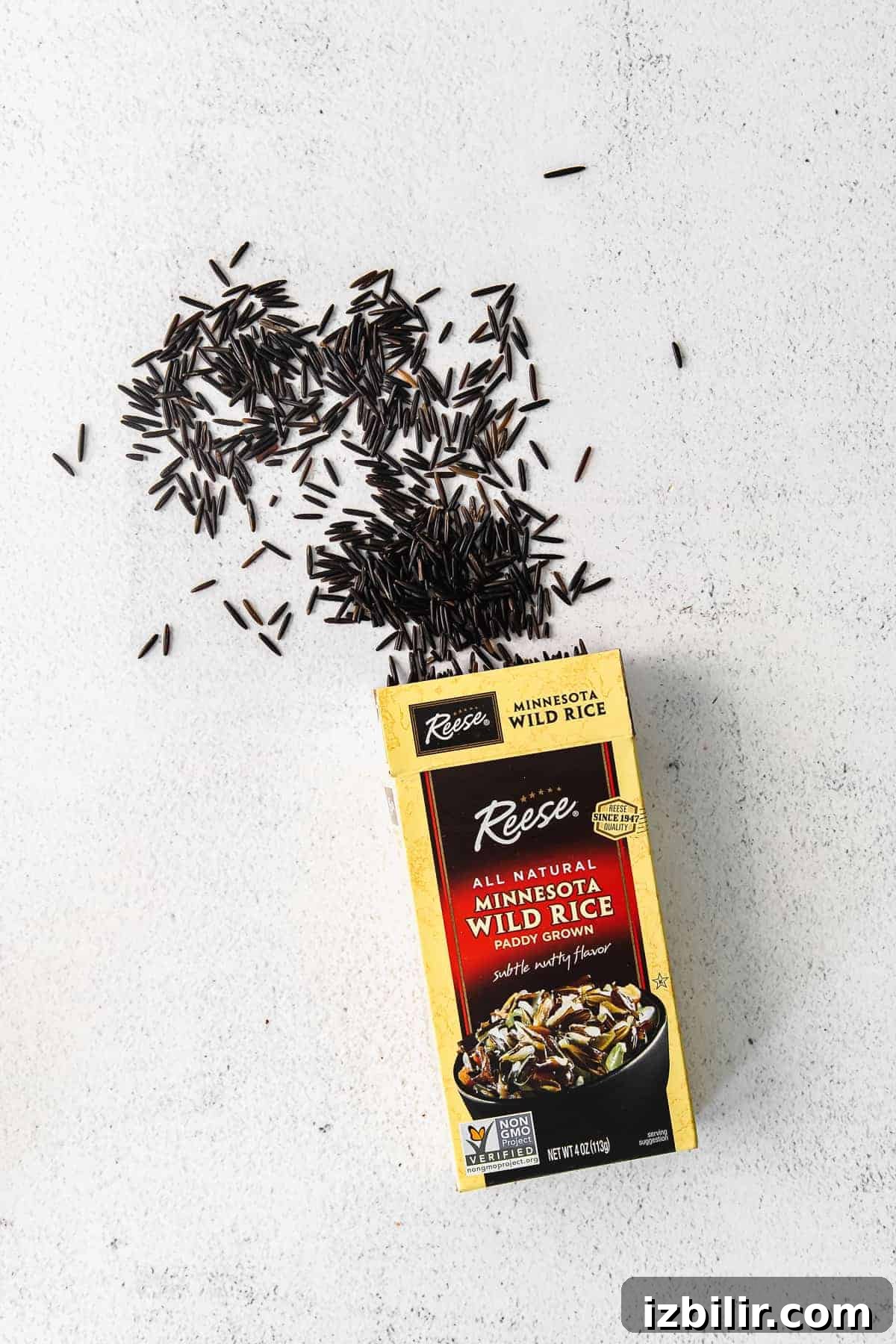 How to Cook Wild Rice: Stovetop, Oven and Rice Cooker Tips 3 Dry wild rice spilling out of a package